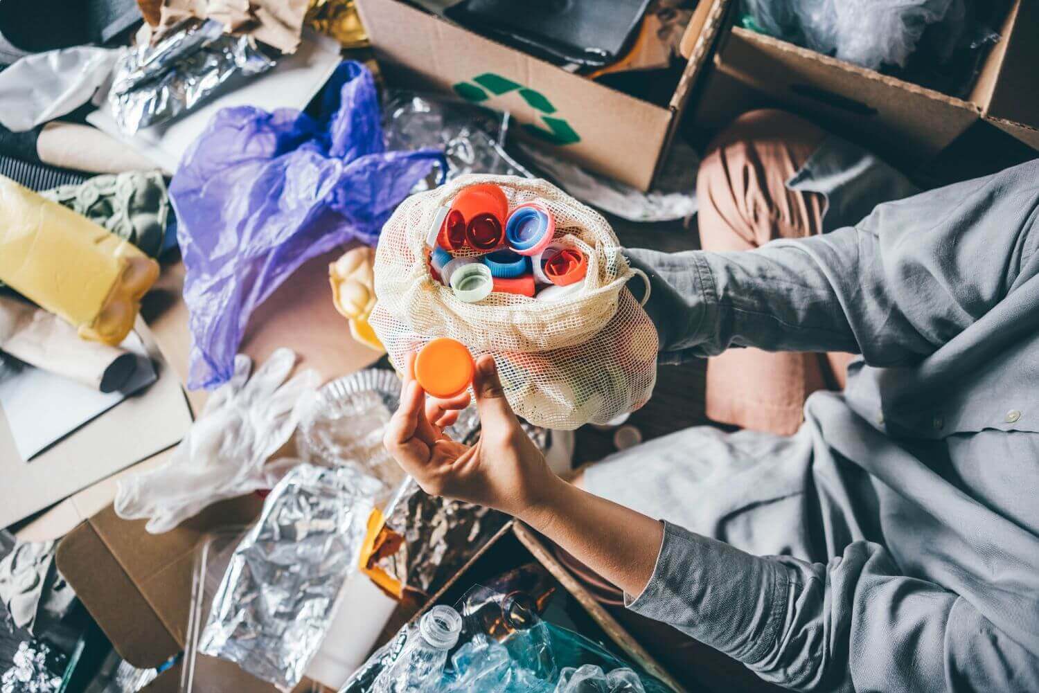 woman-sorting-different-waste-girl-holding-a-plas